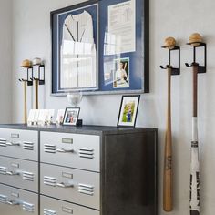 a baseball bat is hanging on the wall next to some lockers and other items