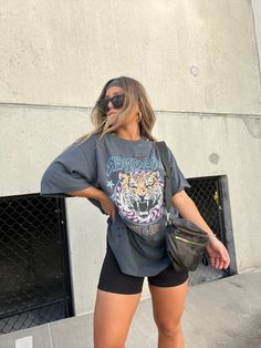 OMG! I CAN'T SAY ENOUGH GOOD THINGS ABOUT OUR NEW DREAM TIGER OVERSIZED TEE/T-SHIRT DRESS! THE QUALITY IS AMAZING! SO THICK AND COMFY! FEATURING DISTRESSED CUTS ON FRONT OF T-SHIRT MODEL IS WEARING A SIZE SMALL/MEDIUM OVERSIZED FIT COLOR: CHARCOAL 100% COTTON MODEL MEASUREMENTS: HEIGHT 5’2”, BUST 37”, WAIST 29”, HIPS 39”, BRA SIZE 34D Baggy Graphic Tee Outfit, Big Tee Shirt Outfits, Everyday Summer Outfits, Graphic T Shirt Outfit, Long Tshirt Outfit, Oversized Summer Outfit, Big T Shirt Outfits, Band Tee Outfits, Oversized Tee Outfit