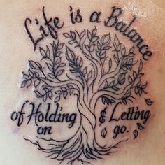 a tree tattoo with words on it