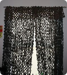 the curtain is made out of black crochet