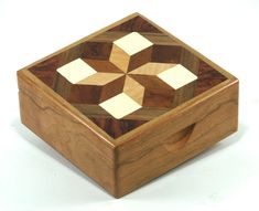 a wooden box with an intricate design on it