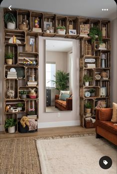 a living room filled with lots of wooden shelves and plants on top of each shelf