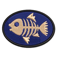 a blue and gold fish embroidered patch