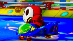 mario kart is riding on a toy car