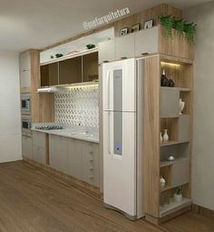 a modern kitchen with white appliances and wood flooring in the middle of an empty room