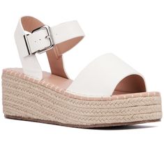 Elevate your summer style with the Elandra. These sandals blend the classic charm of espadrilles with a modern silhouette, finished with polished buckles for a touch of elegance. Perfect for sunny days and balmy nights, they're a versatile addition to any wardrobe. From New York & Company. Modern Wedge Sandals With Buckle For The Beach, Modern Beach Wedge Sandals With Buckle Closure, Modern Beach Wedge Sandals With Buckle, Spring Sandals With Buckle Closure And Wedge Heel, Spring Wedge Heel Sandals With Buckle Closure, White Espadrille Sandals For Summer, Adjustable Buckle Closure Wedge Sandals For Summer, Spring Buckle Closure Closed Toe Espadrilles, Summer Espadrille Sandals For Day Out