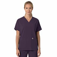 Step into your workday with confidence in the Carhartt Women's Oversized V-Neck Scrub Top. Engineered for healthcare professionals, this scrub top combines style and functionality. The curved V-neck with slim binding and a shoulder badge loop adds a touch of sophistication, while the vented yoke ensures breathability during long shifts. Practicality meets convenience with features like a welt chest pocket, two front top load pockets, a mesh cellphone pocket, and a pen slot. The racerback detail Dobby Fabric, Black Plum, Carhartt Womens, Oversized Top, Pocket Bag, Box Pleats, Scrub Tops, Healthcare Professionals, Top Stitching