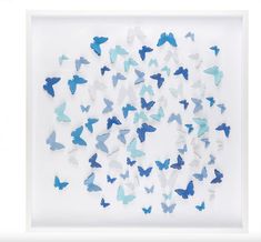 blue and white butterflies are arranged in a square shadow box on a white background,