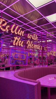 the inside of a restaurant with neon lights