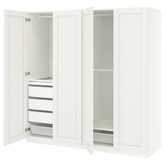 an open white cabinet with drawers and shelves