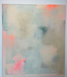 an abstract painting with pastel colors on the wall and white frame in front of it