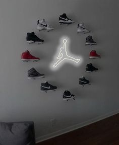 a clock made out of nike shoes hangs on the wall