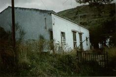 an old abandoned building in the middle of nowhere