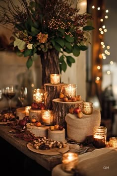 Rustic Fall wedding table decor with candles, burlap, and natural elements like tree stumps and leaves, creating a warm, romantic autumn atmosphere. Boho Fall Wedding Tablescapes, Autumnal Wedding Table Decor, Fall Wedding Venue Decor, Fall Wedding Sweetheart Table Decor, Fall Wedding Fireplace Decor, Blue And Silver Table Decor, Fall Boho Wedding Decor, Cheap Fall Wedding Ideas, Boho Wedding Ideas Decoration