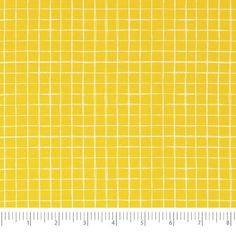 yellow and white checkered fabric with a ruler