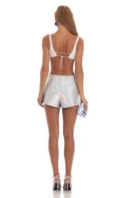 Designed in Los Angeles- Pull-on- Unlined- Made in Iridescent Foil Fabric- Hand wash coldModel is wearing a size small shorts that measures 12in/30cm in lengthSlight modifications might be made to improve garment quality.Handling the garments with care, hand-washing and air-drying is strongly recommended. Iridescent Stretch Bottoms For Summer, Metallic Fitted Shorts, Fitted Metallic Shorts, Metallic Bottoms With Built-in Shorts, Metallic High-waisted Shorts For Party, Iridescent Bottoms For Summer Party, Metallic Shorts For Summer Party, Fitted Metallic Shorts For Summer, Metallic Shorts For Summer Night Out