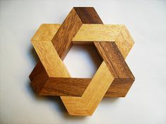 a wooden wall hanging made to look like hexagons