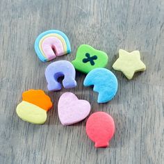 several different shaped cookies sitting on top of a wooden table