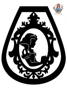 the silhouette of a woman holding a baby in a frame with an ornate border around it