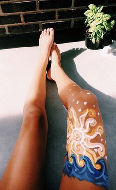 a person has their legs painted like an octopus