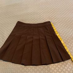 Never Worn Skirt Purchased From Aritzia. Tag Fell Off Fitted Mini Skirt For School Uniform, Fitted Short School Uniform Skirt, Fitted Short Length School Uniform Skirt, Brown Fitted Mini Pleated Skirt, Brown Fitted Short Skirt, Fitted Brown Tennis Skirt, Brown Pleated Tennis Skirt, Fitted Brown Pleated Skirt, High Waist Pleated Brown Skort