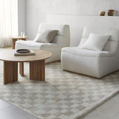 a living room with two chairs and a coffee table