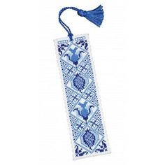 a blue and white bookmark with a tassel