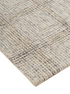 a beige and black rug with squares on it