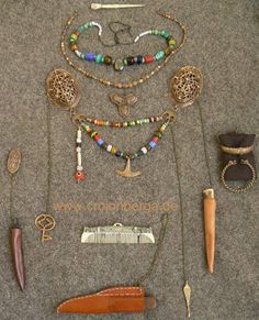 an assortment of jewelry is laid out on the floor