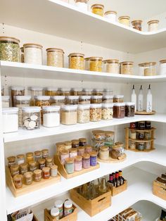 the shelves are filled with various types of spices and condiments, including jars