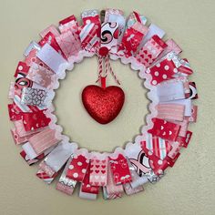 a valentine's day wreath hanging on the wall