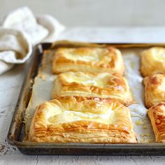 there are many pastry items on the baking sheet