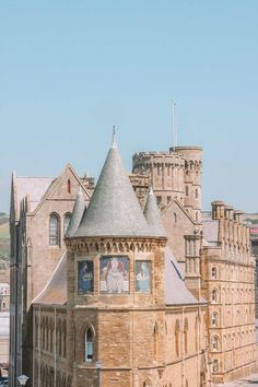 an old building with a clock tower on it's side