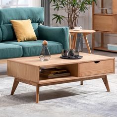 a living room with a blue couch and coffee table