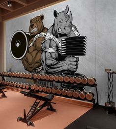 a gym room with a mural on the wall