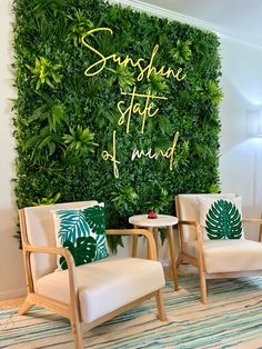 two chairs in front of a green wall with the words sunshine state of mind on it