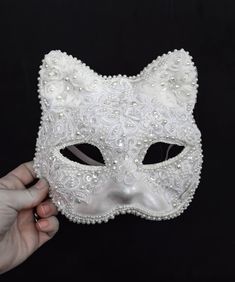 This White Lace Cat Venetian Mask Mardi Gras Carnival Masquerade Costume Ball Bridal Wedding Lent Party is tender, modest and playful at the same time! It is a paper mache mask covered in white lace, transparent sequins, artificial pearls of different sizes, pearly rhinestones and various trim. The sizing would fit an adult or a child, the mask is wide - but please keep in mind that the mannequin in the pictures has a rather narrow face.  The inside of the mask is white and the elastic in the ba Elegant White Masquerade Mask For Weddings, Masquarede Ball Masks, Elegant White Wedding Masquerade Mask, Masquerade Ball Costume, Cat Masquerade Mask, Narrow Face, Carnival Masquerade, Ball Costume, Masquerade Outfit