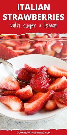 a white plate topped with sliced strawberries