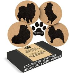 four coasters with black dogs on them next to a box and paw prints in the background