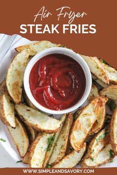 a white plate topped with french fries covered in ketchup next to a bowl of dipping sauce