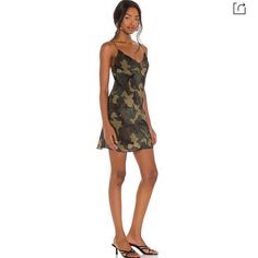 A Classic Camo Pattern Adds An Edgy Juxtaposition To The Voluptuous Drape Of This Silky Slipdress Cut To A Leg-Flaunting Mini Length. Exposed Back-Zip Closure. Size 8 Like New - Never Worn Features * Cowl Neck * Spaghetti Straps * Slip Silhouette * Back Zipper Closure * Lined * Allover Camouflage Print * Imported Material & Care * 100% Cupro; Lining: 94% Polyester/6% Elastane * Dry Clean Mini Slip, Camouflage Print, Mini Slip Dress, Printed Mini Dress, Camo Print, Workout Wear, Alice Olivia, Cowl Neck, Green Dress