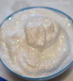 a bowl filled with white liquid on top of a table