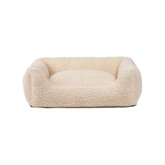 a dog bed that is made out of sheepskin