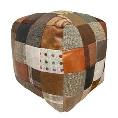 a multicolored patchwork ottoman cushion on white background