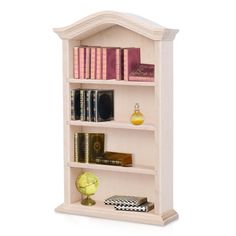 a white book shelf with books and other items on it's shelves in front of a white background