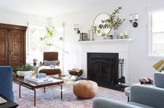 a living room filled with furniture and a fire place