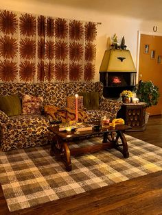 a living room filled with furniture and a fire place in the middle of the room