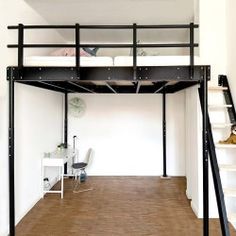 there is a loft bed in the middle of this room with stairs leading up to it