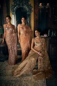 This copper tulle saree features all over tonal sequin and crystal embroidery in a floral pattern. The fully embroidered strappy blouse shows tassels at the waist.From Seema Gujral's Kashish collection DELIVERY TIMEPlease allow 8-12 weeks for your outfit to arrive. FABRIC DETAILSNet Professional cleaning only. Gold Sequin Saree, Strappy Blouse, Copper Dress, Bridal Sari, Desi Dress, Formal Dress Code, Indian Bridal Sarees, Indian Sari Dress, Sequin Saree