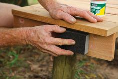 a man is using a table top to build a bench